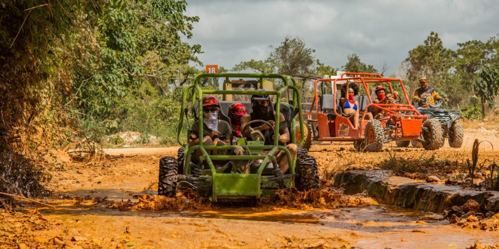 Thrilling buggy ride through the countryside, with participants navigating rugged trails and scenic landscapes in off-road vehicles, experiencing the natural beauty and adventure of rural terrain.