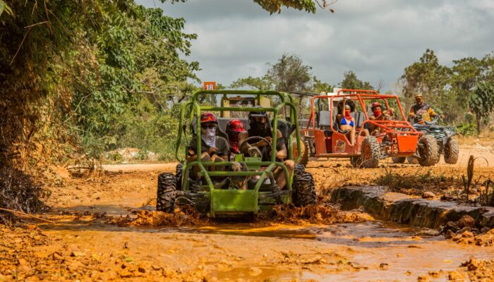 Thrilling buggy ride through the countryside, with participants navigating rugged trails and scenic landscapes in off-road vehicles, experiencing the natural beauty and adventure of rural terrain.