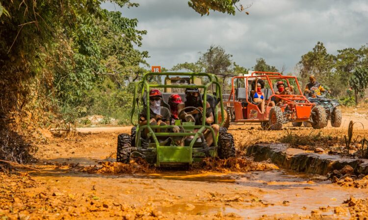 Thrilling buggy ride through the countryside, with participants navigating rugged trails and scenic landscapes in off-road vehicles, experiencing the natural beauty and adventure of rural terrain.