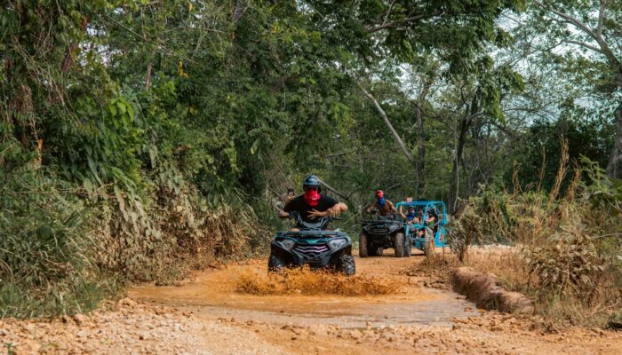 Thrilling buggy ride through the countryside, with participants navigating rugged trails and scenic landscapes in off-road vehicles, experiencing the natural beauty and adventure of rural terrain.