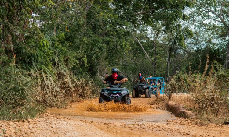 Thrilling buggy ride through the countryside, with participants navigating rugged trails and scenic landscapes in off-road vehicles, experiencing the natural beauty and adventure of rural terrain.