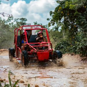 Thrilling buggy ride through the countryside, with participants navigating rugged trails and scenic landscapes in off-road vehicles, experiencing the natural beauty and adventure of rural terrain.