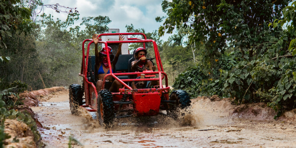 Thrilling buggy ride through the countryside, with participants navigating rugged trails and scenic landscapes in off-road vehicles, experiencing the natural beauty and adventure of rural terrain.