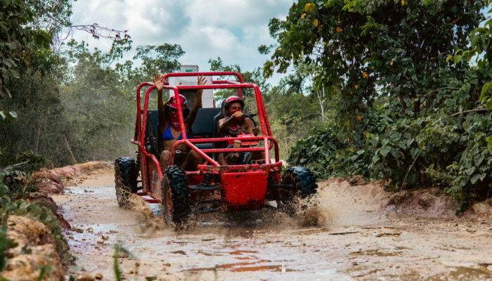 Thrilling buggy ride through the countryside, with participants navigating rugged trails and scenic landscapes in off-road vehicles, experiencing the natural beauty and adventure of rural terrain.