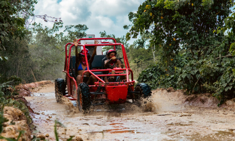 Thrilling buggy ride through the countryside, with participants navigating rugged trails and scenic landscapes in off-road vehicles, experiencing the natural beauty and adventure of rural terrain.