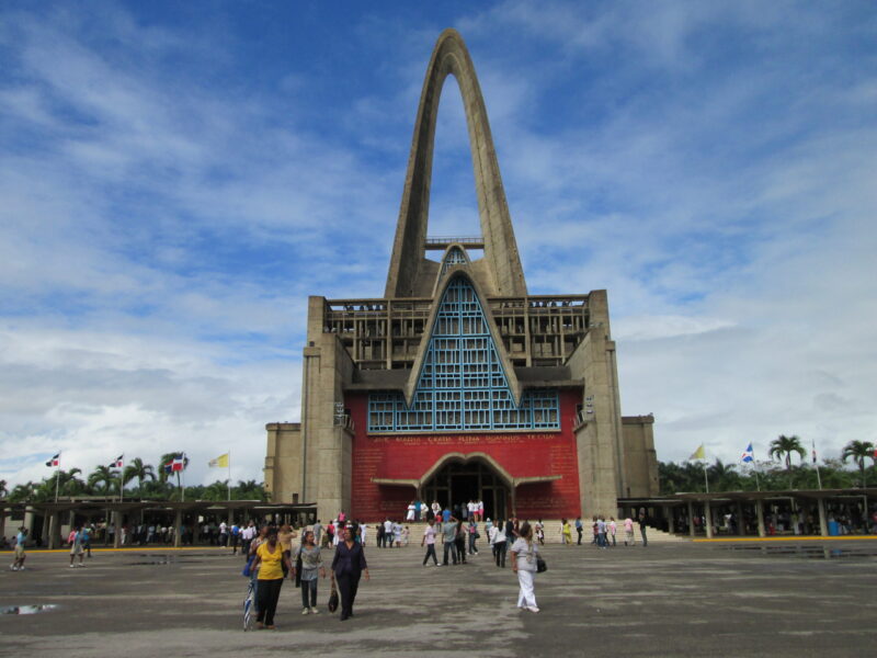 Iconic view of the Higuey Cathedral, also known as La Basílica, featuring its towering arched structure and modern architectural design, a famous religious landmark in the Dominican Republic.