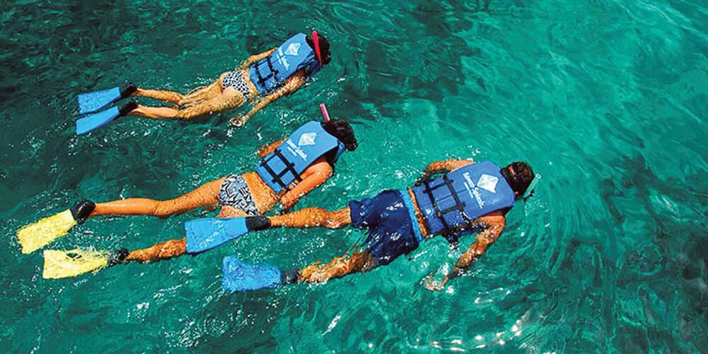 Exciting aquatic adventure featuring a combination of sailing splash activities, speed boat rides, snorkeling explorations, and relaxing catamaran cruises, offering a diverse range of experiences on the water with vibrant marine life and stunning ocean views