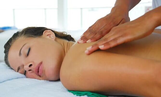 Serene ocean spa setting, featuring luxurious treatment rooms with panoramic ocean views, where guests enjoy relaxing massages and rejuvenating therapies amid the soothing sounds of the waves and a tranquil ambiance.