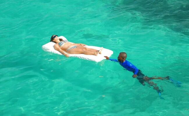 Serene ocean spa setting, featuring luxurious treatment rooms with panoramic ocean views, where guests enjoy relaxing massages and rejuvenating therapies amid the soothing sounds of the waves and a tranquil ambiance.
