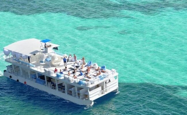 Serene ocean spa setting, featuring luxurious treatment rooms with panoramic ocean views, where guests enjoy relaxing massages and rejuvenating therapies amid the soothing sounds of the waves and a tranquil ambiance.