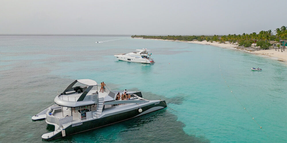 Luxurious top-rated catamaran boat, featuring sleek design and spacious deck with comfortable seating, ideal for a premium sailing experience. Guests enjoy panoramic ocean views and high-quality amenities on board