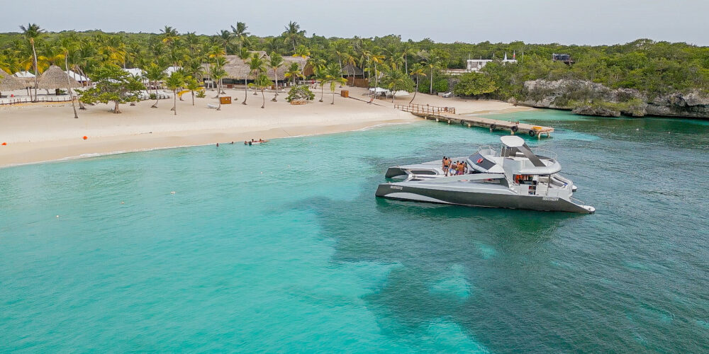 Luxurious top-rated catamaran boat, featuring sleek design and spacious deck with comfortable seating, ideal for a premium sailing experience. Guests enjoy panoramic ocean views and high-quality amenities on board