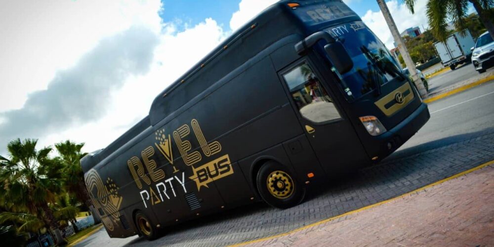 Fun-filled party bus interior, featuring vibrant lighting, comfortable seating, and music, with guests dancing and enjoying themselves while traveling to various destinations in a lively and festive atmosphere