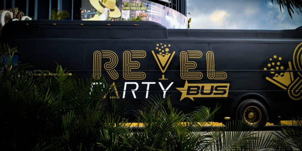 Fun-filled party bus interior, featuring vibrant lighting, comfortable seating, and music, with guests dancing and enjoying themselves while traveling to various destinations in a lively and festive atmosphere