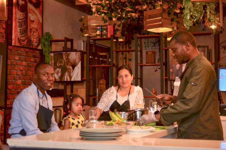 Traditional Sancocho Cooking Master Class, guiding participants through the process of preparing the Dominican Republic's signature stew with a blend of meats, root vegetables, and spices.