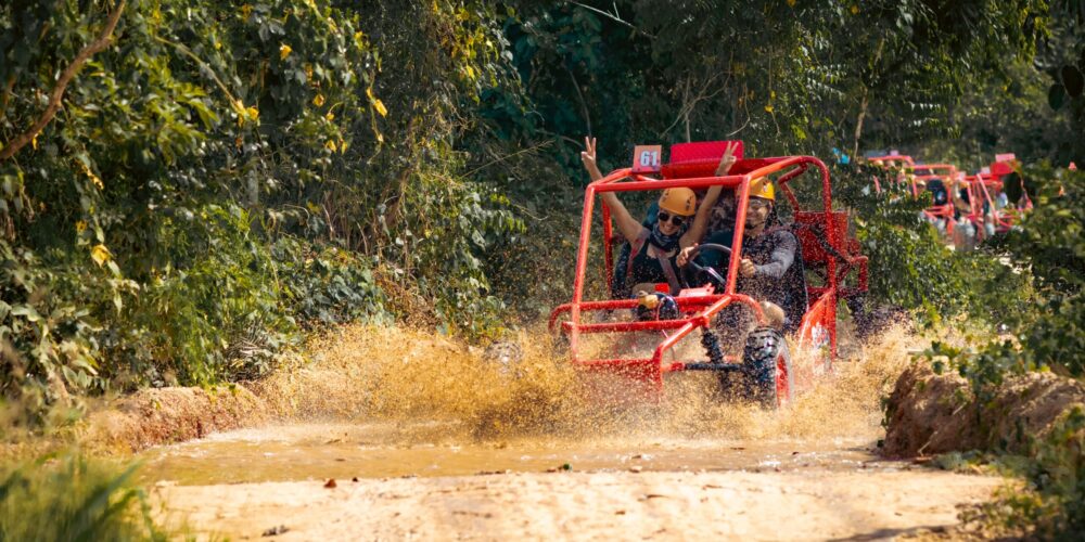 Thrilling buggy ride through the countryside, with participants navigating rugged trails and scenic landscapes in off-road vehicles, experiencing the natural beauty and adventure of rural terrain.