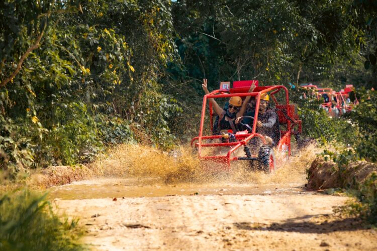 Thrilling buggy ride through the countryside, with participants navigating rugged trails and scenic landscapes in off-road vehicles, experiencing the natural beauty and adventure of rural terrain.