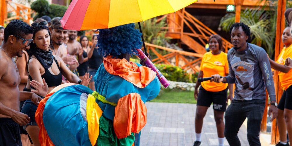 Colorful Carnival Show featuring lively dancers in extravagant costumes, vibrant masks, and rhythmic music, celebrating the festive spirit and cultural heritage of the Caribbean.