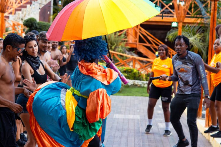 Colorful Carnival Show featuring lively dancers in extravagant costumes, vibrant masks, and rhythmic music, celebrating the festive spirit and cultural heritage of the Caribbean.