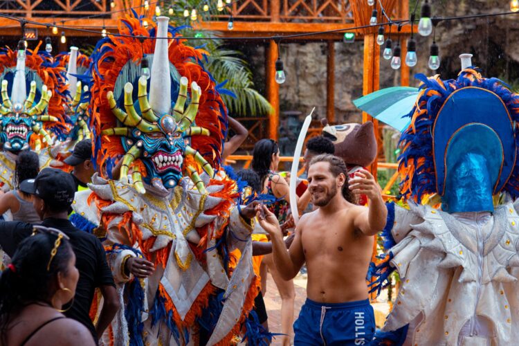 Colorful Carnival Show featuring lively dancers in extravagant costumes, vibrant masks, and rhythmic music, celebrating the festive spirit and cultural heritage of the Caribbean.