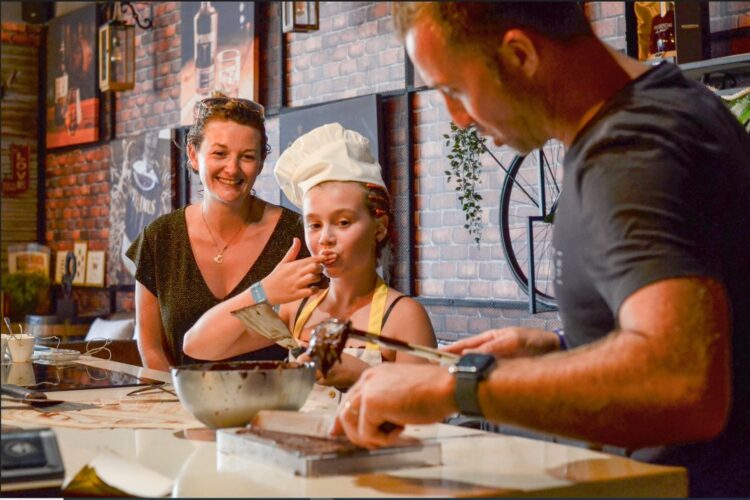 Hands-on Chocolate Master Class, teaching participants how to craft rich, artisanal chocolate from cacao beans, with techniques for tempering, molding, and flavoring.