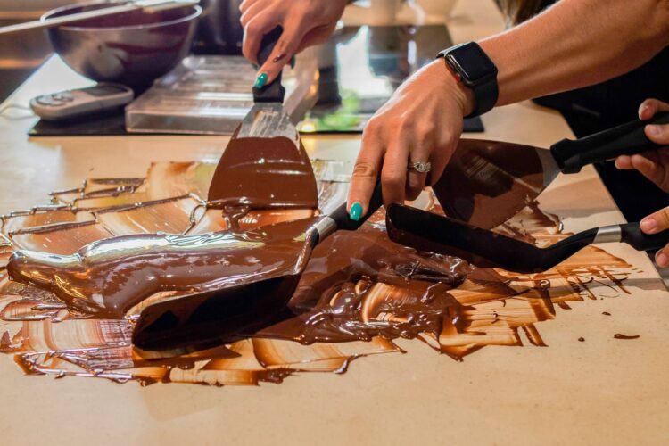 Hands-on Chocolate Master Class, teaching participants how to craft rich, artisanal chocolate from cacao beans, with techniques for tempering, molding, and flavoring.