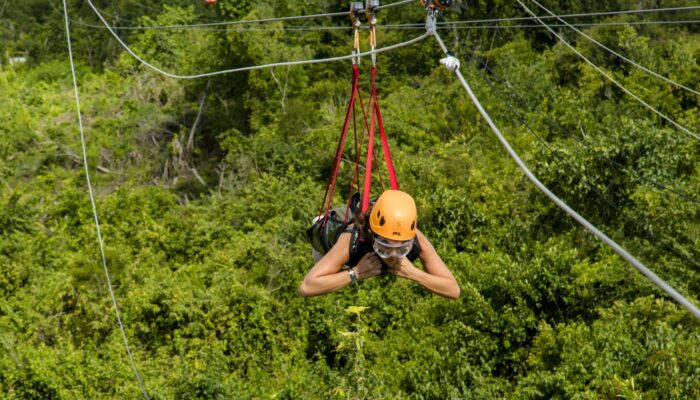 Adventure-filled Scape Park in Punta Cana, showcasing lush tropical landscapes, zip lines, underground caves, and natural cenotes for visitors to explore and enjoy