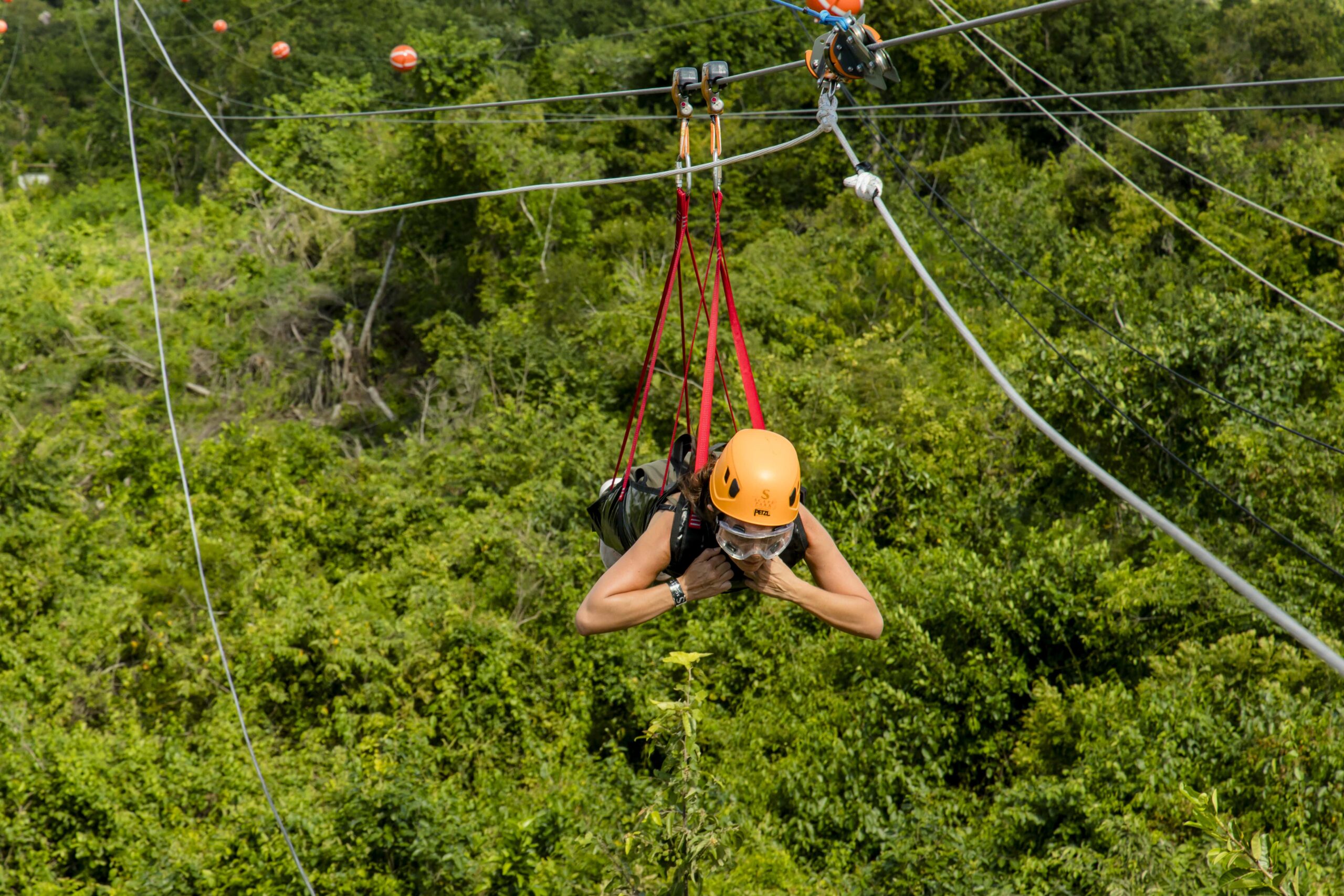 Adventure-filled Scape Park in Punta Cana, showcasing lush tropical landscapes, zip lines, underground caves, and natural cenotes for visitors to explore and enjoy