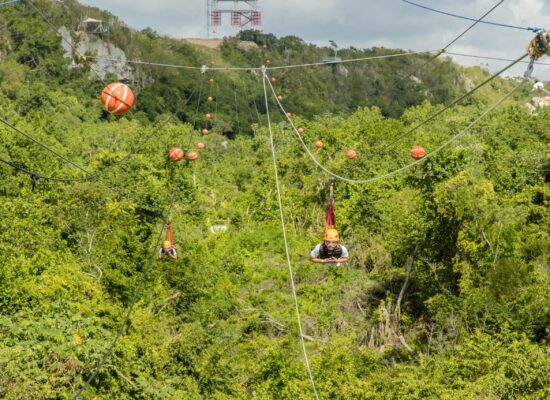 Adventure-filled Scape Park in Punta Cana, showcasing lush tropical landscapes, zip lines, underground caves, and natural cenotes for visitors to explore and enjoy