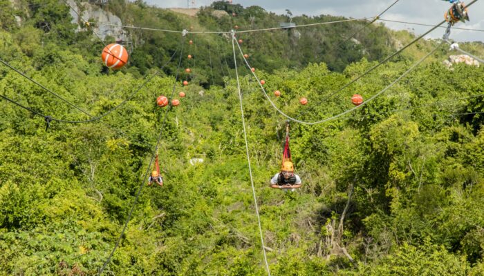 Adventure-filled Scape Park in Punta Cana, showcasing lush tropical landscapes, zip lines, underground caves, and natural cenotes for visitors to explore and enjoy