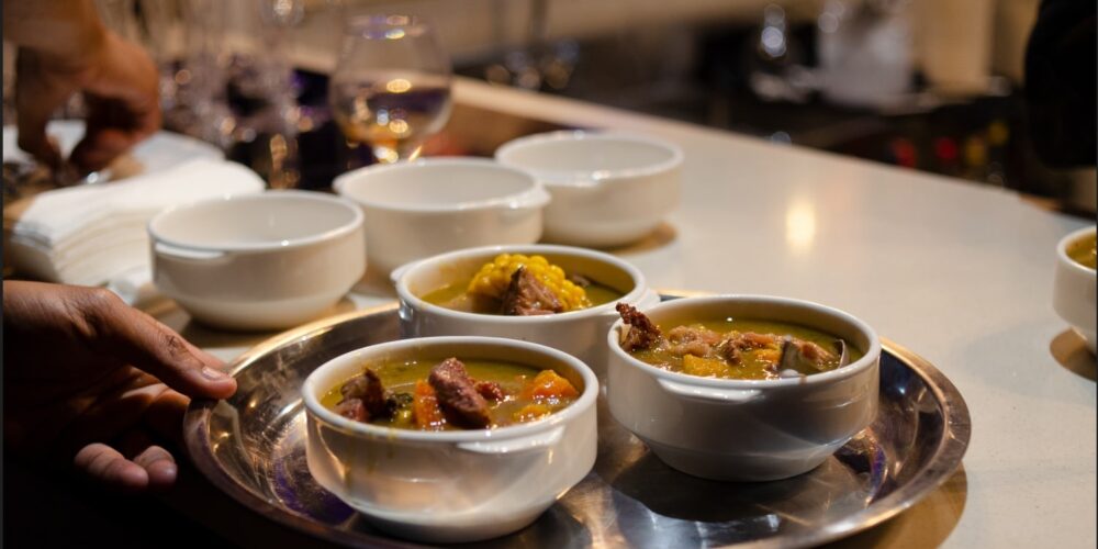 Traditional Sancocho Cooking Master Class, guiding participants through the process of preparing the Dominican Republic's signature stew with a blend of meats, root vegetables, and spices.