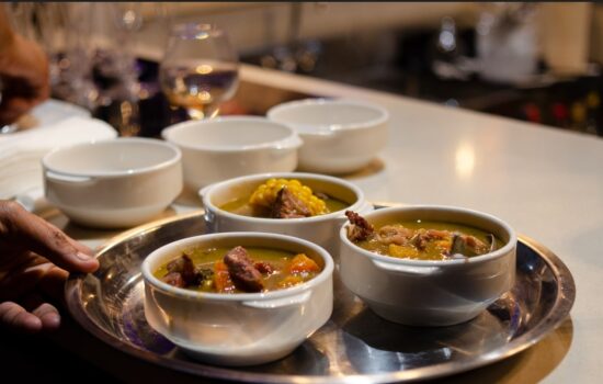 Traditional Sancocho Cooking Master Class, guiding participants through the process of preparing the Dominican Republic's signature stew with a blend of meats, root vegetables, and spices.