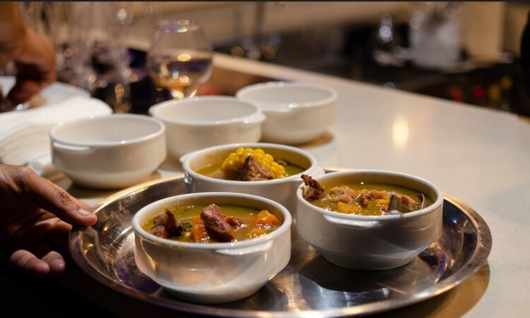Traditional Sancocho Cooking Master Class, guiding participants through the process of preparing the Dominican Republic's signature stew with a blend of meats, root vegetables, and spices.