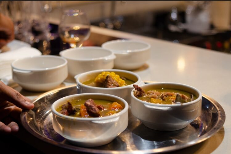 Traditional Sancocho Cooking Master Class, guiding participants through the process of preparing the Dominican Republic's signature stew with a blend of meats, root vegetables, and spices.