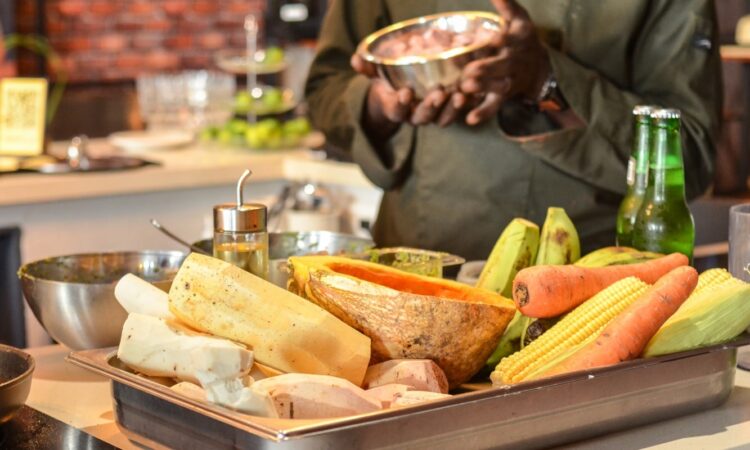 Traditional Sancocho Cooking Master Class, guiding participants through the process of preparing the Dominican Republic's signature stew with a blend of meats, root vegetables, and spices.