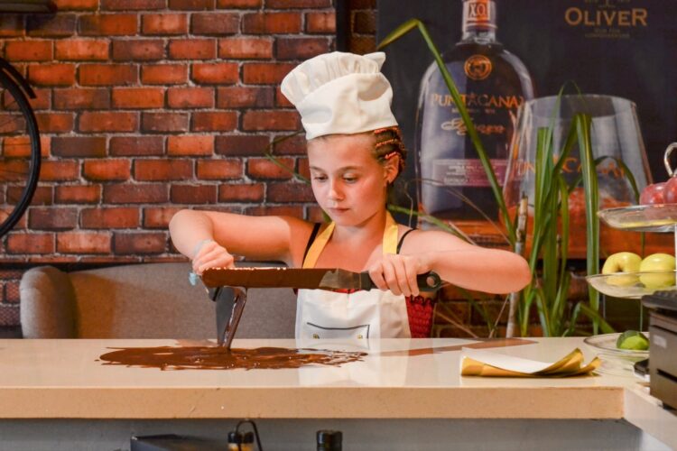 Hands-on Chocolate Master Class, teaching participants how to craft rich, artisanal chocolate from cacao beans, with techniques for tempering, molding, and flavoring.