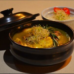 Traditional Sancocho Cooking Master Class, guiding participants through the process of preparing the Dominican Republic's signature stew with a blend of meats, root vegetables, and spices.