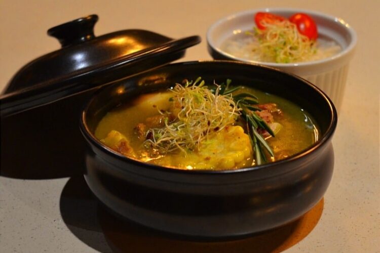 Traditional Sancocho Cooking Master Class, guiding participants through the process of preparing the Dominican Republic's signature stew with a blend of meats, root vegetables, and spices.