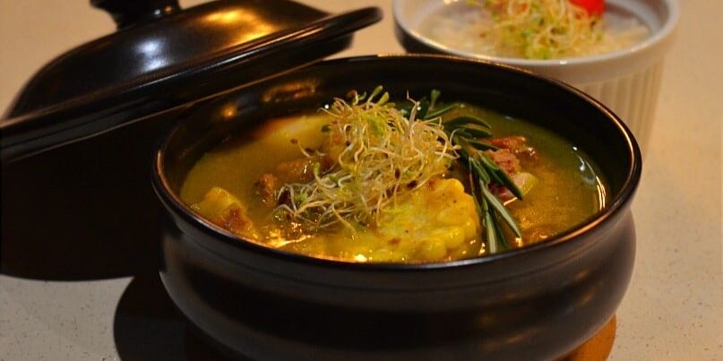 Traditional Sancocho Cooking Master Class, guiding participants through the process of preparing the Dominican Republic's signature stew with a blend of meats, root vegetables, and spices.