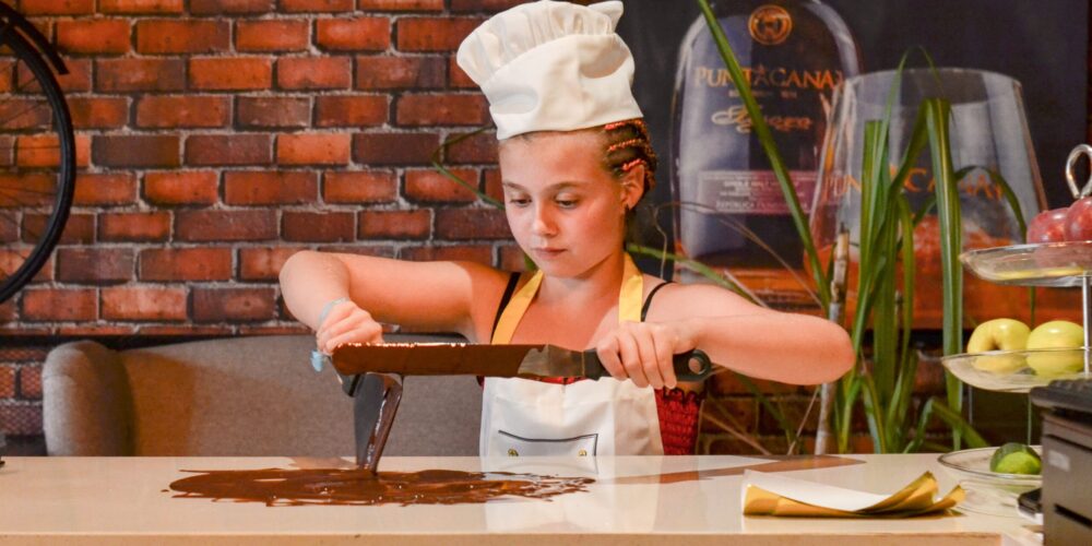 Hands-on Chocolate Master Class, teaching participants how to craft rich, artisanal chocolate from cacao beans, with techniques for tempering, molding, and flavoring.