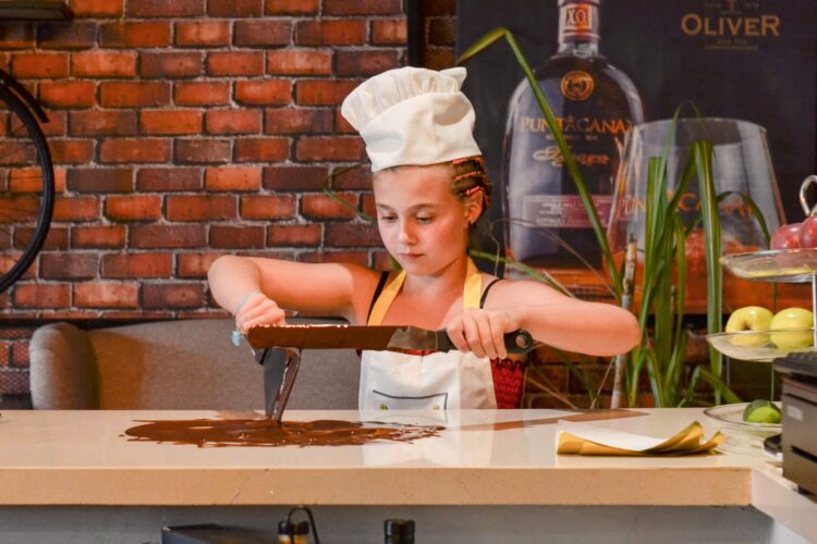 Hands-on Chocolate Master Class, teaching participants how to craft rich, artisanal chocolate from cacao beans, with techniques for tempering, molding, and flavoring.