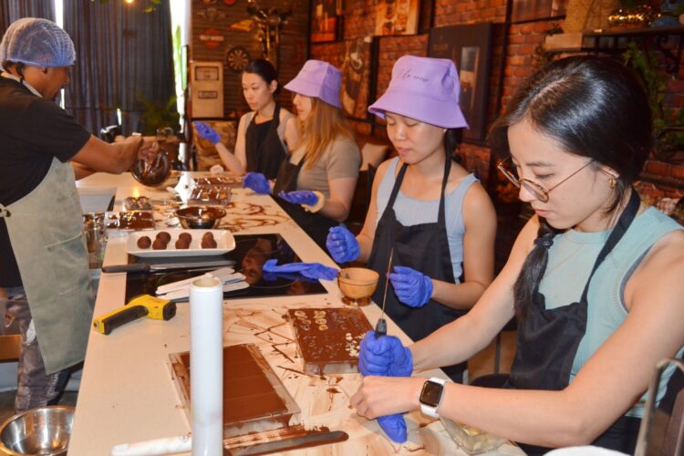 Hands-on Chocolate Master Class, teaching participants how to craft rich, artisanal chocolate from cacao beans, with techniques for tempering, molding, and flavoring.