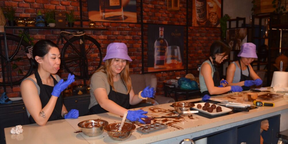 Hands-on Chocolate Master Class, teaching participants how to craft rich, artisanal chocolate from cacao beans, with techniques for tempering, molding, and flavoring.