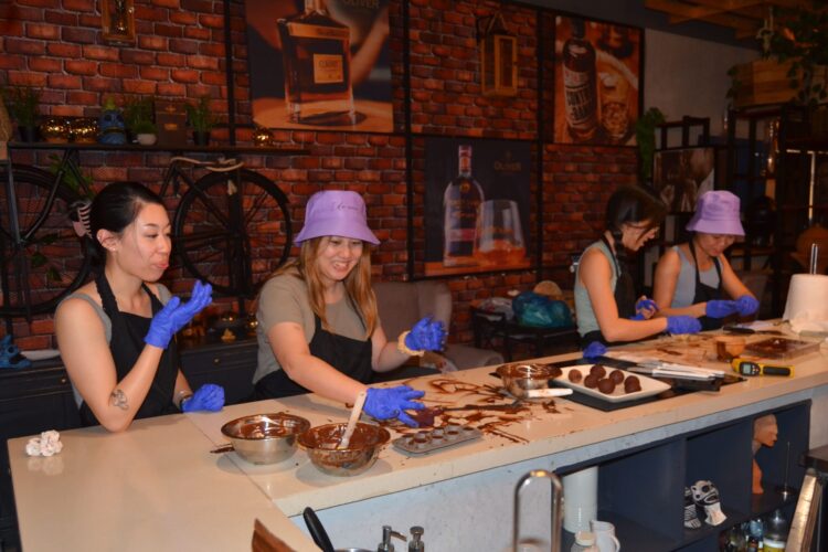 Hands-on Chocolate Master Class, teaching participants how to craft rich, artisanal chocolate from cacao beans, with techniques for tempering, molding, and flavoring.