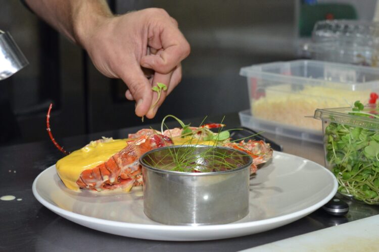 Expert-led Lobster Master Class, offering step-by-step guidance on preparing and cooking fresh lobster, including cleaning, seasoning, and plating techniques for a gourmet seafood experience.