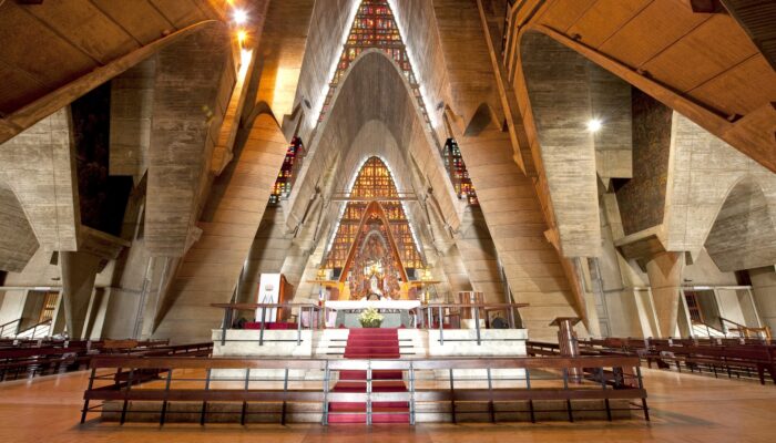 Iconic view of the Higüey Cathedral, also known as La Basilica, featuring its towering arched structure and modern architectural design, a famous religious landmark in the Dominican Republic.