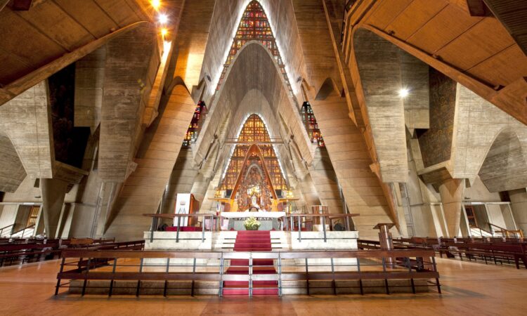 Iconic view of the Higüey Cathedral, also known as La Basilica, featuring its towering arched structure and modern architectural design, a famous religious landmark in the Dominican Republic.