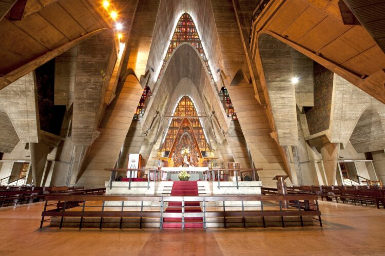 Iconic view of the Higüey Cathedral, also known as La Basilica, featuring its towering arched structure and modern architectural design, a famous religious landmark in the Dominican Republic.