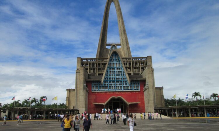 Iconic view of the Higuey Cathedral, also known as La Basílica, featuring its towering arched structure and modern architectural design, a famous religious landmark in the Dominican Republic.
