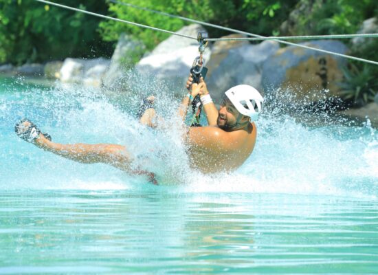 Adventure-filled Scape Park in Punta Cana, showcasing lush tropical landscapes, zip lines, underground caves, and natural cenotes for visitors to explore and enjoy